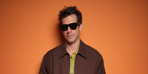 Mark Ronson wears Gucci GG1668S 001 sunglasses to the brand's Spring/Summer 2025 fashion show in Milan