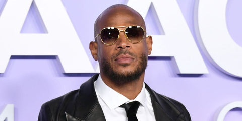 Actor Marlon Wayans was seen wearing gold Dita Artoa 79 DTS 161 01 aviator sunglasses with grey gradient lenses at the NAACP Image Awards 2025.