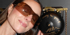 Comedian Mary Beth Barone was seen wearing gold Miu Miu MU B53S 5AK20P rimless sunglasses with bronze lenses in her Instagram post, February 2026