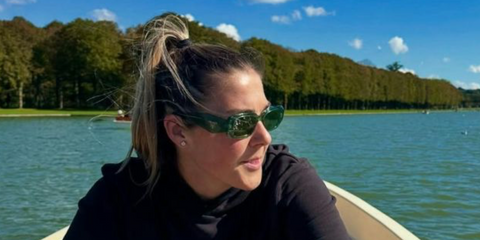 Footballer Mary Earps of Paris Saint-Germain FC was seen wearing transparent bottle green Prada PR 17WS 19Z1I0 Symbole sunglasses with green lenses 