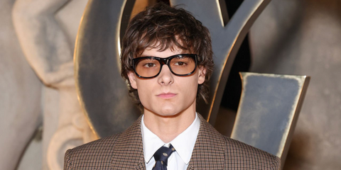 Mason Thames was seen wearing havana tortoiseshell Saint Laurent Sun SL 815 Romy 009 sunglasses with light brown lenses at the Saint Laurent Fall/Winter 2026 fashion show during Paris Fashion Week.