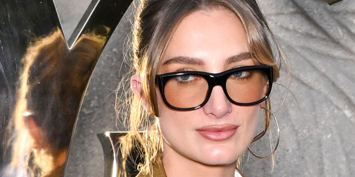 Cultural figure and showjumper Mathilde Pinault was seen wearing black Saint Laurent Sun SL 815 Romy 006 sunglasses with light brown lenses at the Saint Laurent Spring/Summer 2026 fashion show during Paris Fashion Week.