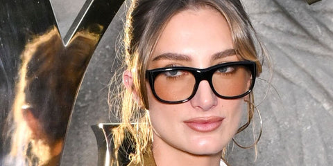 Cultural figure and showjumper Mathilde Pinault was seen wearing black Saint Laurent Sun SL 815 Romy 006 sunglasses with light brown lenses at the Saint Laurent Spring/Summer 2026 fashion show during Paris Fashion Week.