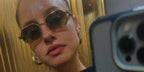 Italian actress Matilde Gioli was seen wearing gold Prada PR A51S 15N01T hexagonal sunglasses in her Instagram mirror selfie post
