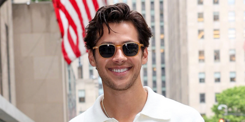 Actor and singer Matt Cornett was seen wearing beige Oliver Peoples Emryn OV5598SU 1779/R5 sunglasses with blue lenses in New York City, June 2026.