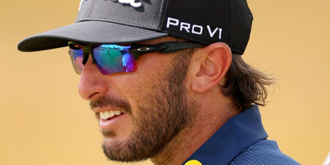 Professional golfer Max Homa was seen wearing black Oakley Flak 2.0 XL OO9188 05 sunglasses at The 152nd Open championship in Troon, Scotland, July 2024. Shop online now on Pretavoir