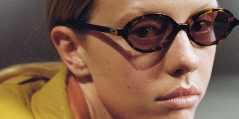 Mia Goth modeled Miu Miu MU 04ZS 19P2Z1 sunglasses for the brand's Fall/Winter 2022 campaign