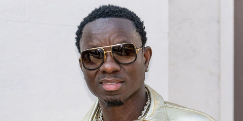 Comedian Michael Blackson was seen wearing Dita Mach One DRX 2030 B - Gold & Black sunglasses in Philadelphia, July 2025. Shop online now on Pretavoir