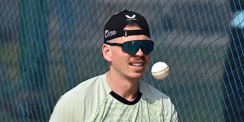 New Zealand cricketer Michael Bracewell was seen wearing matte navy Oakley Sutro Lite Sweep OO9465 05 Prizm sunglasses at the ICC Men's T20 World Cup 2026.