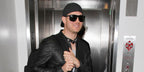 Michael Buble was seen wearing black Ray-Ban 4147 601/58 Polarised sunglasses at Los Angeles International Airport