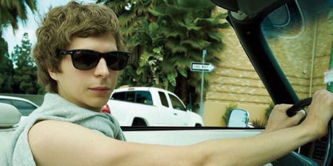 Michael Cera was seen wearing the iconic black Ray-Ban New Wayfarer RB 2132 901L sunglasses in a Vanity Fair feature, July 2010.