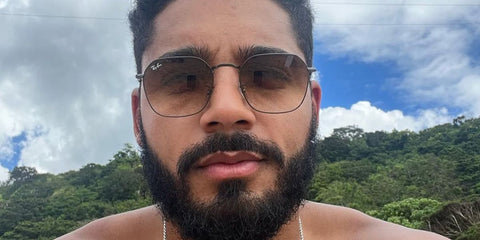 Actor Michael Evans Behling was seen wearing gunmetal Ray-Ban Jim RB 3694 004/51 sunglasses with brown gradient lenses in his Instagram post, May 2023.