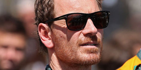 Michael Fassbender was seen wearing Tom Ford Giulio TF698 01J black rectangular sunglasses with brown lenses to attend the 24 Hours of Le Mans race in France