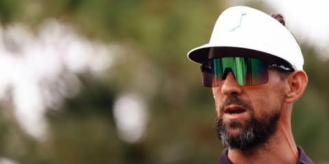 Former competitive swimmer and Olympic champion Michael Phelps was seen wearing black Oakley Sutro Lite OO9463 49 sunglasses with Prizm golf lenses at The Match 10 Golf Competition.