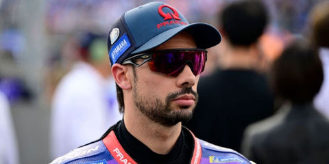 Portuguese motorcycle racer Miguel Oliveira was seen wearing matte black Oakley Sphaera Slash OO9499 06 Prizm sunglasses at the MotoGP of Portugal 2025.