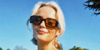 Celebrity actress Millie Gibson was seen wearing tortoiseshell Prada PR 17WS VAU2Z1 Symbole sunglasses with brown lenses in a social media post.