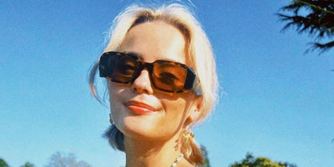 Celebrity actress Millie Gibson was seen wearing tortoiseshell Prada PR 17WS VAU2Z1 Symbole sunglasses with brown lenses in a social media post.