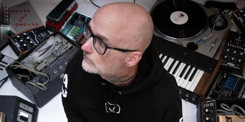 Musician Moby was seen wearing matte black Ray-Ban RB 7047 5196 optical glasses in his Instagram post, December 2025.
