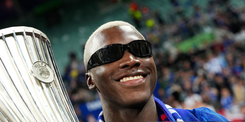 Ecuadorian footballer Moises Caicedo of Chelsea FC was seen wearing black Prada PR A19S 1AB5S0 wraparound sunglasses in a photograph with the UEFA Conference League trophy after his team's victory in the UEFA Conference League Final 2025