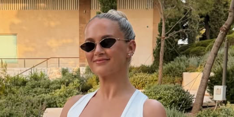 Molly-Mae Hague was seen wearing gold Miu Miu MU 56ZS ZVN5S0 sunglasses with dark grey lenses in Athens, shared through her Instagram post in July 2026.