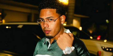 Puerto Rican rapper and singer Myke Towers was seen wearing silver Cartier CT0564O 002 rimless butterfly-shaped optical glasses in his Instagram post, September 2025.