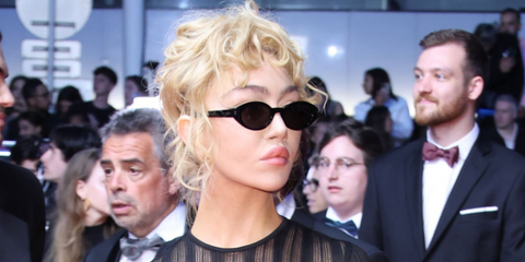 British photographer and filmmaker Nadia Lee Cohen was seen wearing black Saint Laurent Sun SL 567 001 oval sunglasses at the Cannes Film Festival 2024. Shop online now on Pretavoir