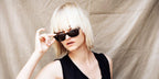 Swiss model Nadine Strittmatter was seen wearing tortoiseshell Ray-Ban Wayfarer 2140 902 sunglasses, photographed by Franco Tettamanti