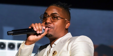 Nas (Nasir Jones) was seen wearing gold Gucci GG1420OK 001 glasses at the Nas & Hennessy Hip-Hop's 50th Anniversary Limited Edition Bottle Celebration in New York City