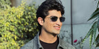 Pakistani cricketer Naseem Shah was seen wearing legend gold Ray-Ban RB 3717 9196/S2 rectangular sunglasses with blue polarised chromance lenses