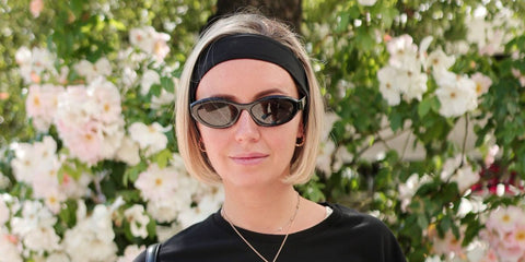 Creative director and travel influencer Nataly Osmann was seen wearing black Prada PR 26ZS 16K08Z cat eye sunglasses at the Cannes Film Festival 2024.