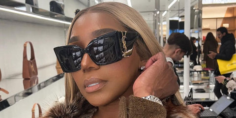 Television personality NeNe Leakes of the Real Housewives of Atlanta was seen wearing black Saint Laurent Sun Blaze SL M119 001 sunglasses in her Instagram post, March 2023.