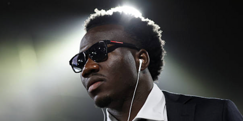 Australian footballer Nestory Irankunda was seen wearing shiny black Prada Linea Rossa SPS 06Y 1AB09U square sunglasses with grey gradient lenses at the FIFA World Cup 2026