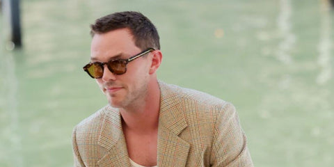 Nicholas Hoult is seen wearing Prada PR A16S 14O60F Photochromic sunglasses to the 2024 Venice Film Festival