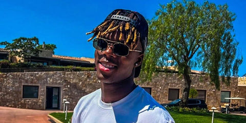 Spanish football athlete Nico Williams was seen wearing gold Ray-Ban RB 3719 001/31 sunglasses with green lenses during his holiday in Italy