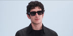 Italian actor Nicolas Maupas was seen wearing black Prada PR 02ZS 1AB06T sunglasses with grey gradient lenses at the Prada Menswear Spring/Summer 2025 fashion show during Milan Men's Fashion Week.
