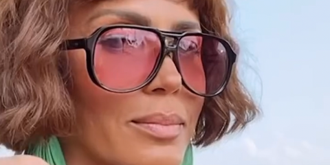 Nicole Ari Parker wears Cutler and Gross Sun 9782 01 Black on Pink sunglasses on the set of 'And Just Like That...' Season 3