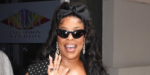 Niecy Nash was seen wearing black Saint Laurent Sun SL 213 001 Lily cat eye sunglasses in New York City, April 2026.