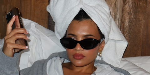 Television actress Nikki Rodriguez was seen wearing black Prada PR 26ZS 16K08Z cat-eye sunglasses in her Instagram post, February 2025.