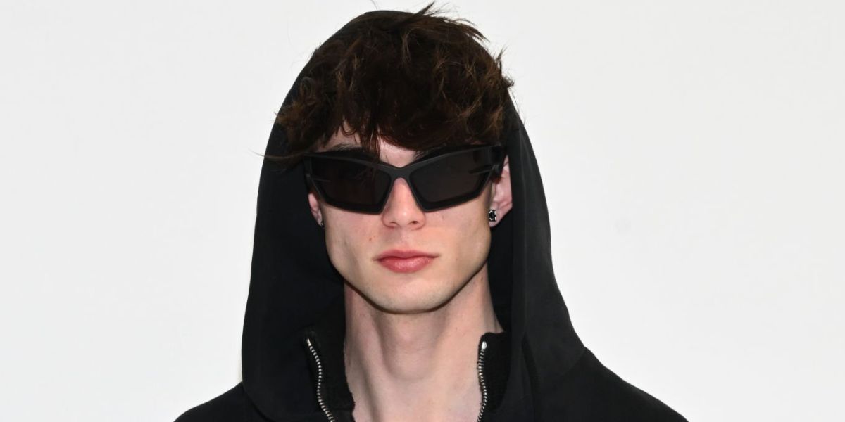 German digital creator Nils Kuesel was seen wearing black Givenchy Giv Cut GV40049I 02A sunglasses at the Givenchy Fall/Winter 2023 fashion show during Paris Fashion Week.