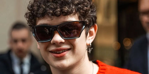 Noah Jupe was seen wearing transparent brown and black Loewe x Paula's Ibiza LW40143U 47A sunglasses at the Loewe Menswear Spring/Summer 2025 fashion show during Paris Men's Fashion Week