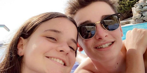Noah Schnapp was seen wearing the iconic black Ray-Ban Clubmaster RB 3016 901/58 half-rim sunglasses with Polarised lenses during a family vacation