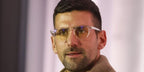 Novak Djokovic wears Oliver Peoples Romare OV5459U 1011 optical glasses in a press conference in Belgrade, March 2024
