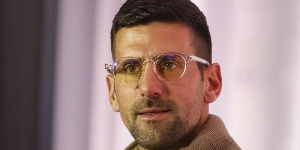 Novak Djokovic wears Oliver Peoples Romare OV5459U 1011 optical glasses in a press conference in Belgrade, March 2024