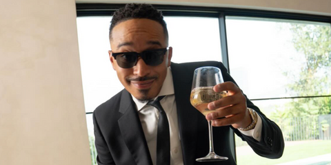 Singer-songwriter October London was seen wearing Saint Laurent Sun SL 420 Slim Metal 001 half-rim sunglasses in his Instagram post, November 2025.