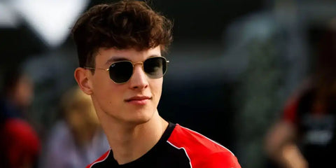 Formula racer Ollie Bearman was seen wearing Ray-Ban RB 3548N 001 Hexagonal Gold sunglasses With Flat Lenses