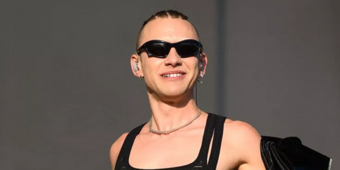 Olly Alexander of Years & Years was seen wearing black Balenciaga BB0229S 001 sunglasses at the 2022 Glastonbury Festival