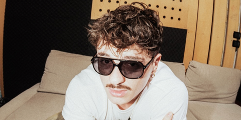 Italian singer Olly Inclusive was seen wearing black Ray-Ban Bill Summer Edition RB 2198 901/53 sunglasses with violet lenses in a social media post.
