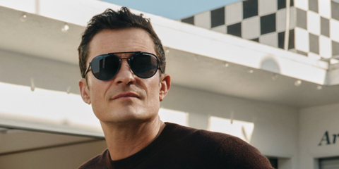 Orlando Bloom was seen wearing matte black Porsche Design 8972 D Polarised sunglasses in a Porsche Design campaign.