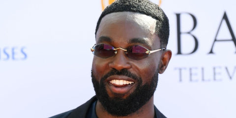 Actor Paapa Essiedu was seen wearing gold Cartier Panthere CT0433S 003 diamond-shaped sunglasses with blue lenses at the BAFTA Television Awards 2024. Shop online now on Pretavoir