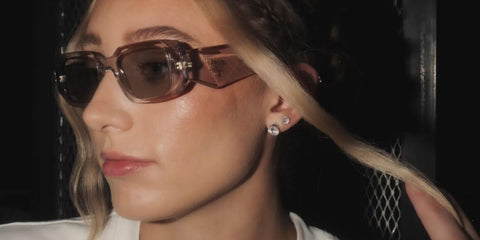 Basketball player Paige Bueckers was seen wearing transparent pink Prada PR 17WS 19Q10D sunglasses in a social media post.